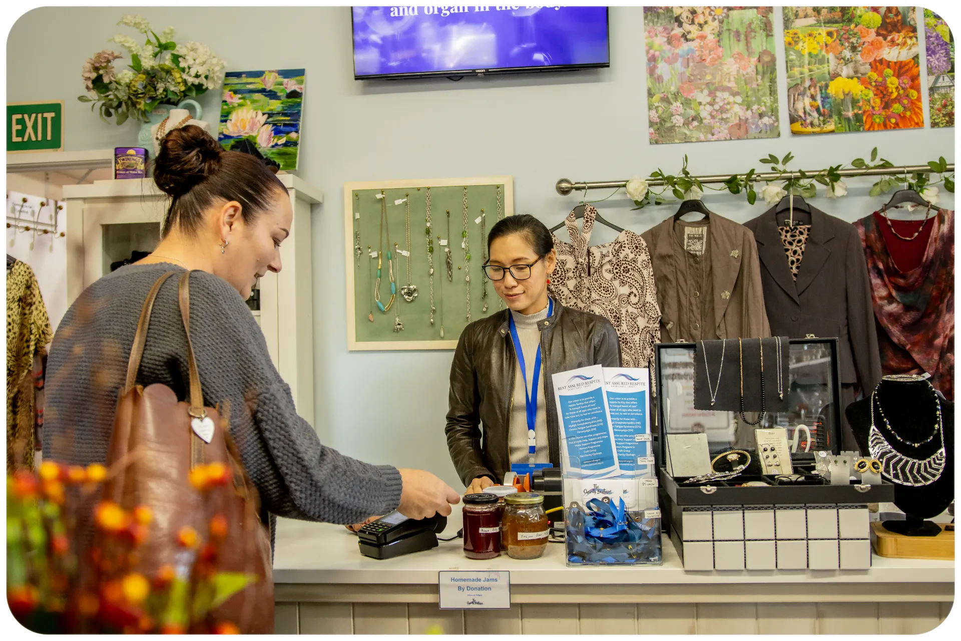 A lady being served at the Charity Boutique