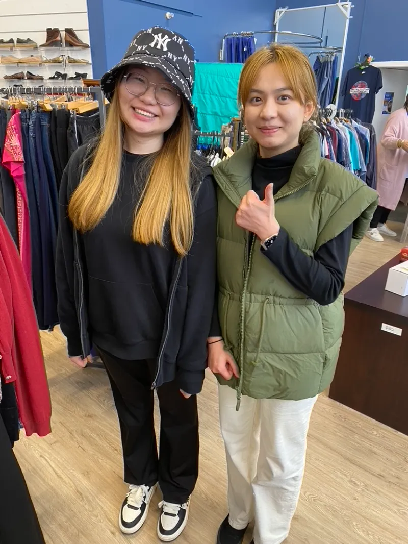 Two ME Respite volunteers standing in a store