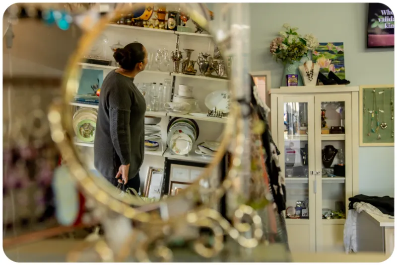 A shopper browsing items at an ME Respite Op Shop