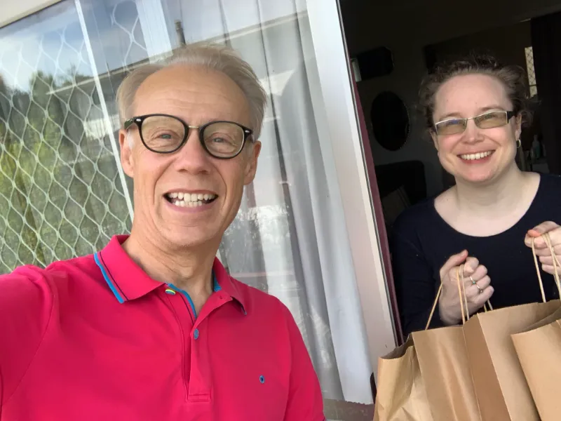 A ME Respite meal recipient being delivered a meal from a volunteer in Howick